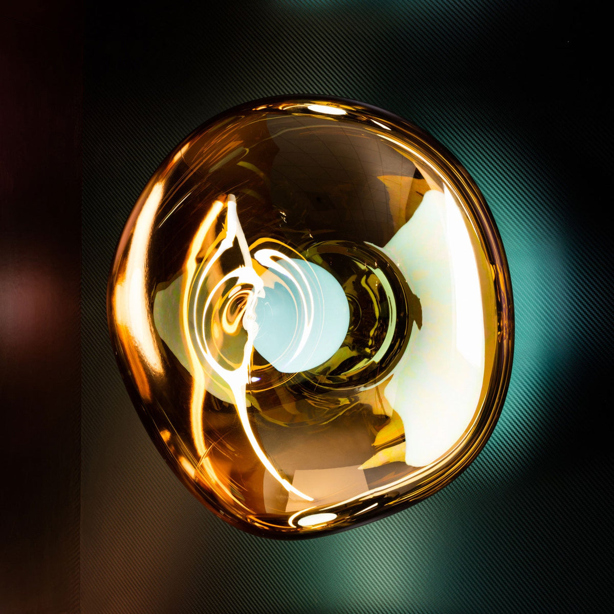 Tom Dixon Melt Medium Surface Light in gold in an interior installation
