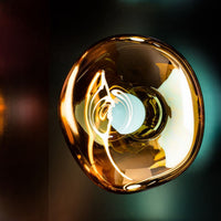 Tom Dixon Melt Medium Surface Light in gold in a lifestyle setting