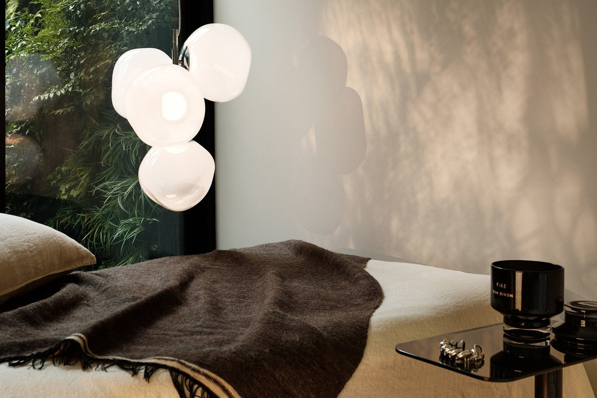Tom Dixon Melt Mini Chandelier in opal with silver hardware in an interior