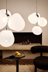 Tom Dixon Melt Small Chandelier in opal with silver hardware in an interior