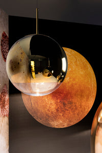 Tom Dixon Mirror Ball gold pendant close-up in a modern interior