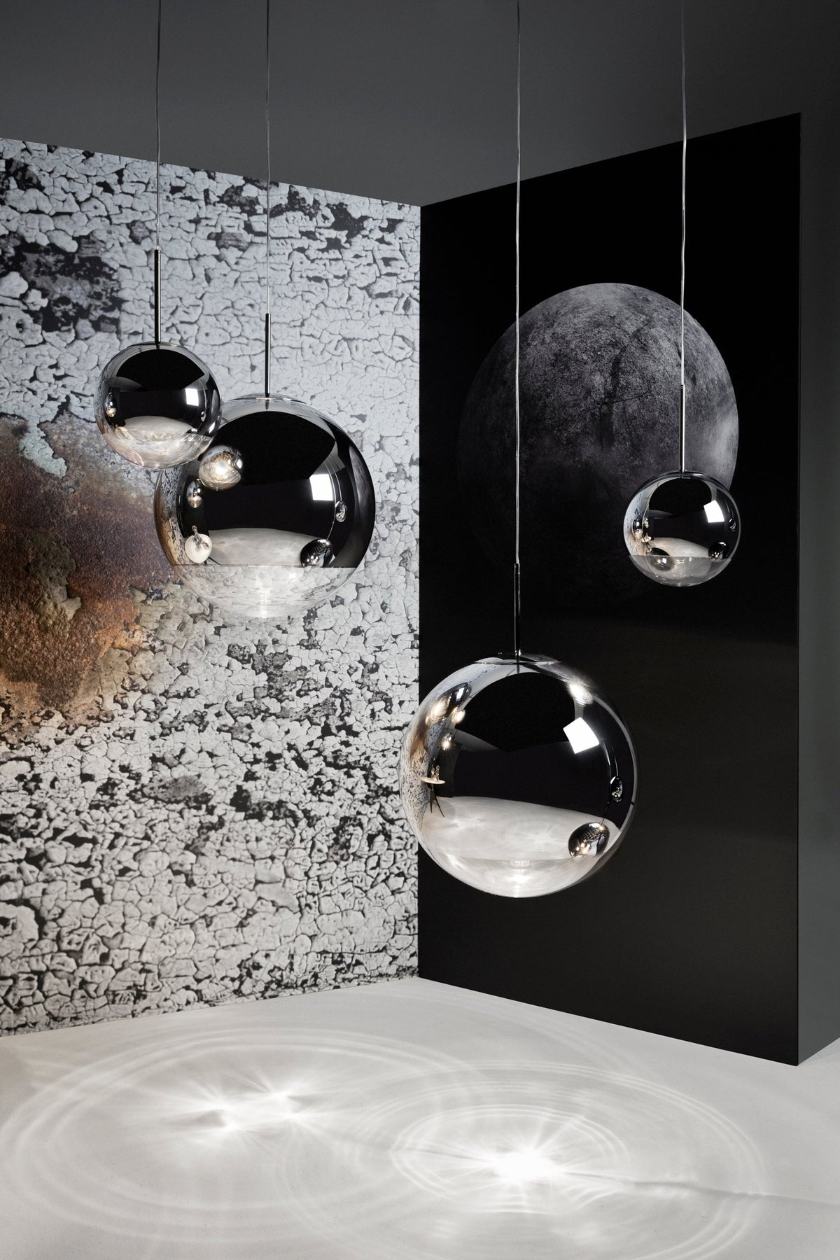 Tom Dixon Mirror Ball silver pendants in a vertical lighting installation