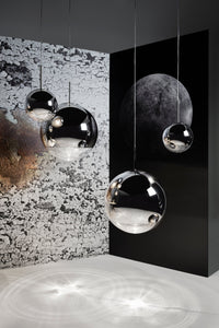 Tom Dixon Mirror Ball silver pendants in a vertical lighting installation