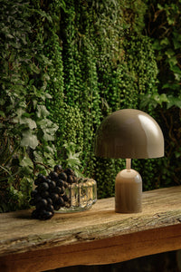 Tom Dixon Press Medium Sphere Pendant in clear pressed glass above a modern kitchen island