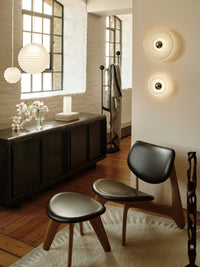 Tom Dixon Press Mini Surface Light in frosted pressed glass in an interior installation