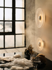 Tom Dixon Press Mini Surface Light in frosted pressed glass in a room setting