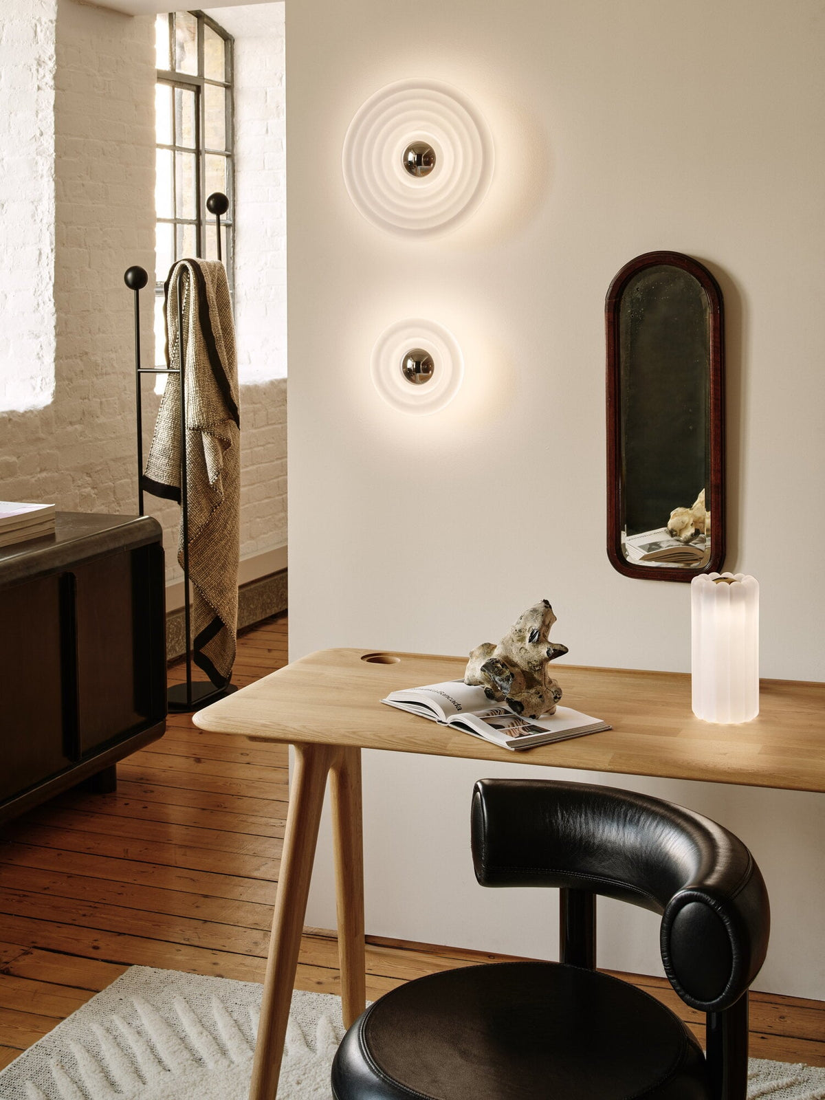Tom Dixon Press Mini Surface Light in frosted pressed glass in a contemporary interior