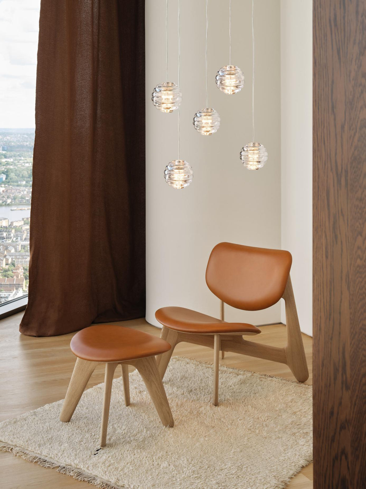Tom Dixon Press Mini Sphere clear pendants in a clustered installation