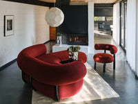 Tom Dixon Soft Large Pendant above a modern red seating area