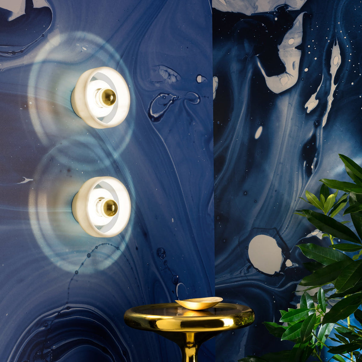 Tom Dixon Stone Wall Light with Spun lighting in an interior installation
