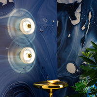 Tom Dixon Stone Wall Light with Spun lighting in an interior installation
