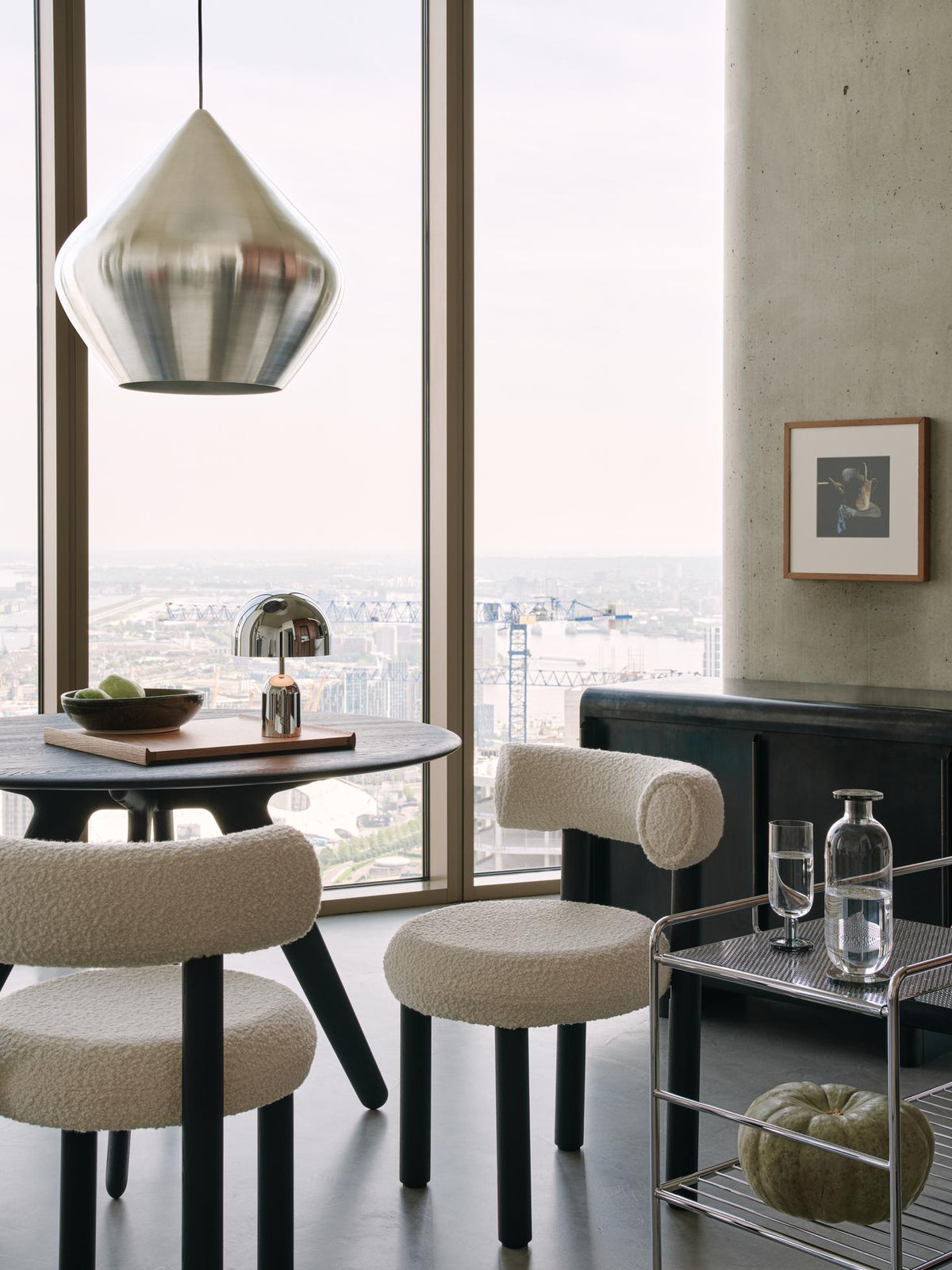 Tom Dixon Unbeaten Stout Pendant above a modern dining area