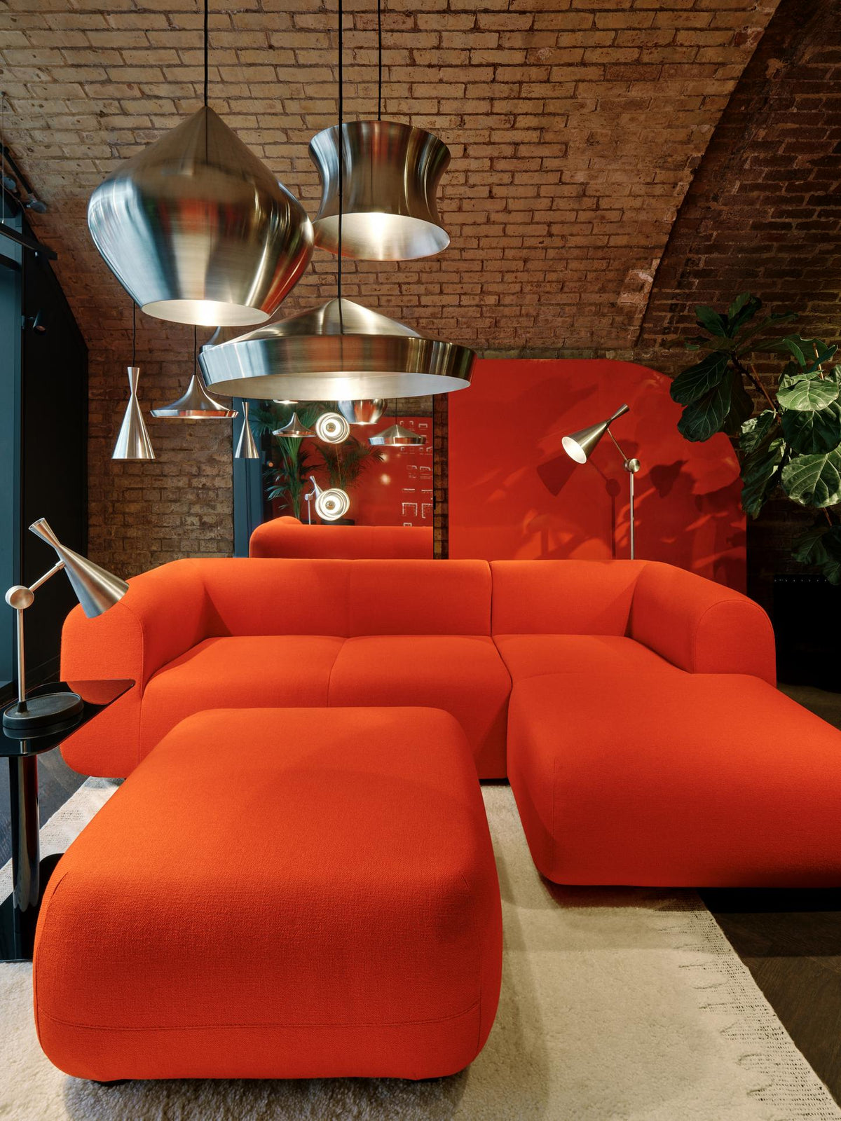 Tom Dixon Unbeaten Waist Pendant in a red modern interior