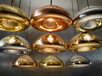 Tom Dixon Void pendant family in brass, copper, and steel finishes