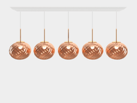 Tom Dixon Whirl copper linear pendant system illuminated