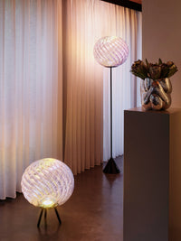 Whirl Dichroic Large Portable Light by Tom Dixon in an interior or outdoor setting