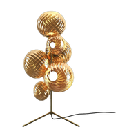 Whirl Floor Chandelier in Gold Polished Polycarbonate by Tom Dixon