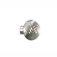Tom Dixon Whirl Surface Light in silver, illuminated