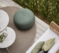Circle footstool setting by Cane-line