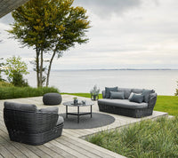 Circle rug outdoor seating lifestyle image by Cane-line