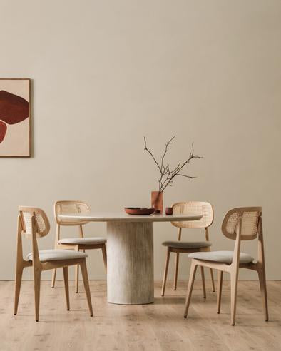 Ari round dining table and Titus chairs portrait lifestyle