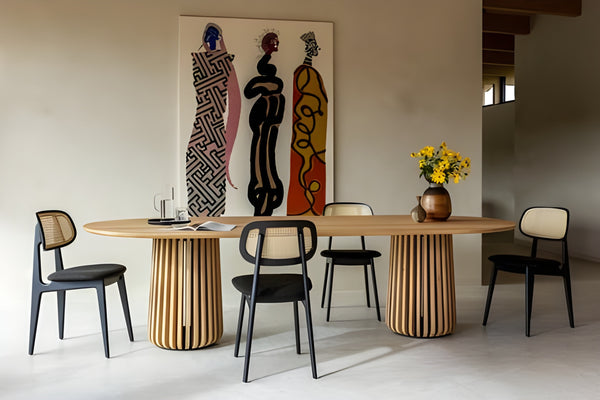 Maru oval dining table with Titus dining chairs in an interior